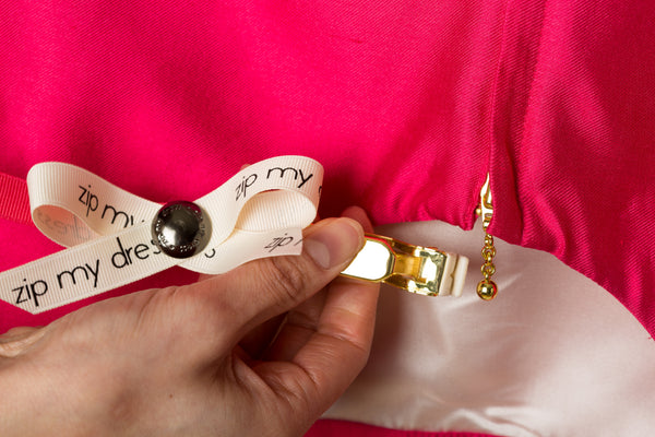 <strong>zip my dress<sup>®</sup></strong> Pink ribbon